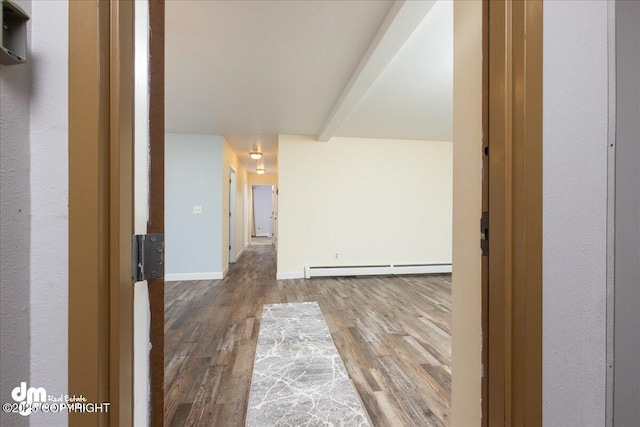 hallway featuring a baseboard heating unit, beamed ceiling, wood finished floors, and baseboards