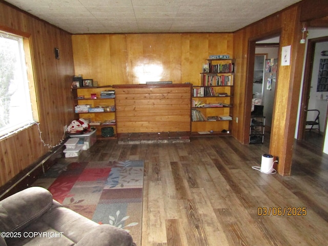 interior space with wooden walls and wood finished floors