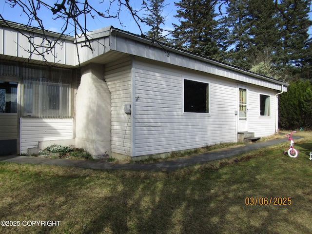 view of property exterior featuring a yard