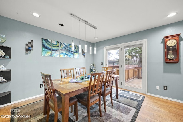 dining area featuring recessed lighting, baseboards, and light wood-style floors