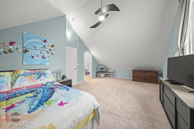 carpeted bedroom featuring a ceiling fan and vaulted ceiling