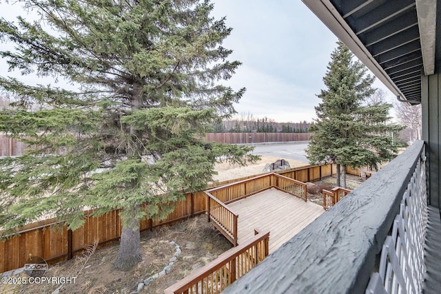 deck with a fenced backyard