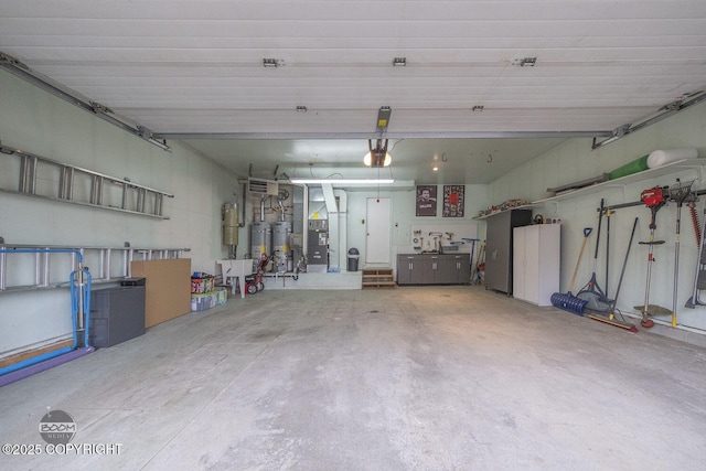 garage featuring heating unit, secured water heater, and a garage door opener