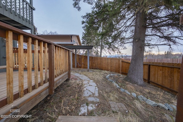 view of yard featuring a wooden deck and a fenced backyard