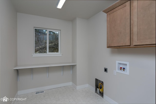 laundry area featuring cabinet space, baseboards, visible vents, hookup for a washing machine, and electric dryer hookup