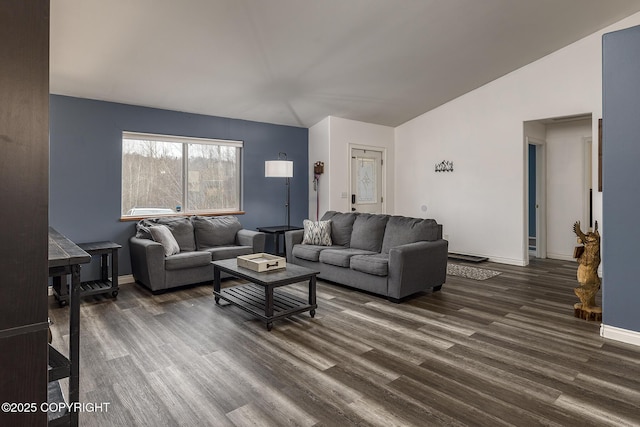 living room with dark wood-type flooring and baseboards