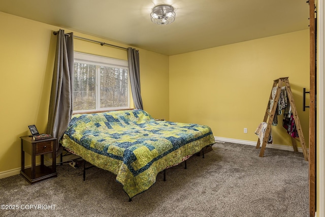 carpeted bedroom with baseboards
