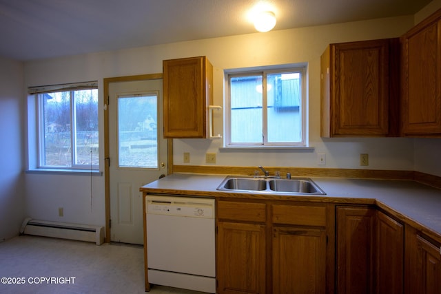 kitchen with white dishwasher, a baseboard heating unit, brown cabinets, and a sink