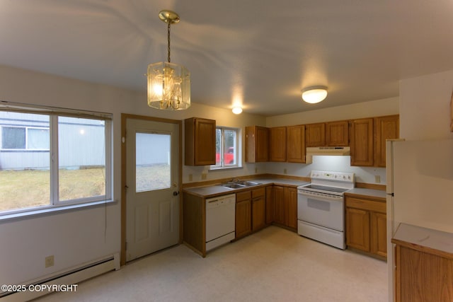 kitchen with brown cabinets, light countertops, baseboard heating, white appliances, and under cabinet range hood