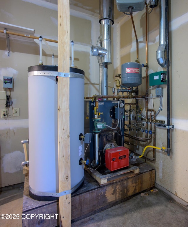 utility room featuring water heater