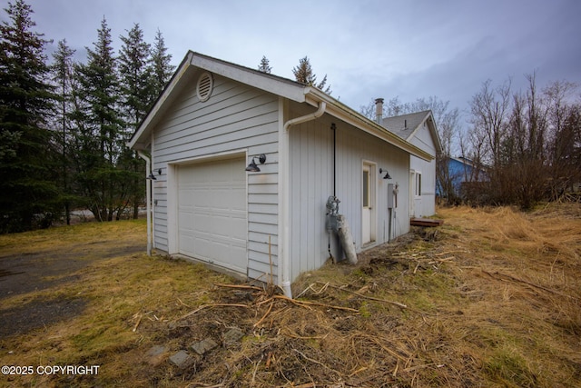 garage featuring driveway