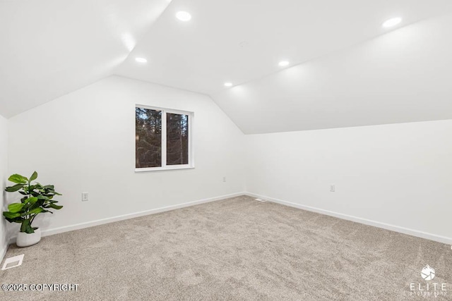 bonus room with baseboards, visible vents, lofted ceiling, carpet floors, and recessed lighting