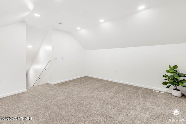 additional living space with lofted ceiling, baseboards, carpet floors, and recessed lighting