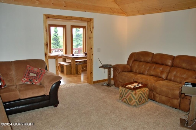 living area with carpet floors, lofted ceiling, wood ceiling, and baseboards