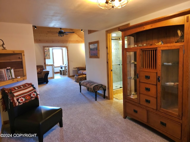 interior space featuring carpet flooring and a ceiling fan