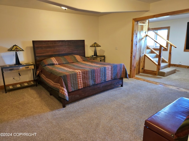 carpeted bedroom with baseboards