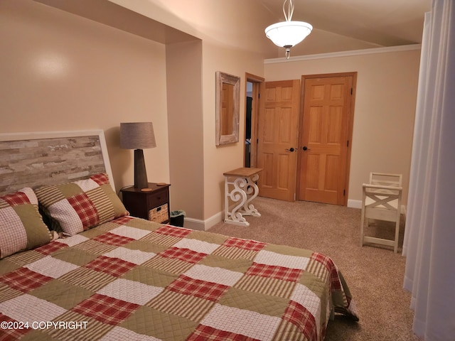 carpeted bedroom with baseboards and crown molding