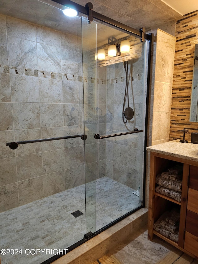 full bath with a shower stall