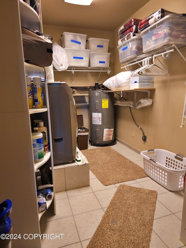 utility room featuring electric water heater