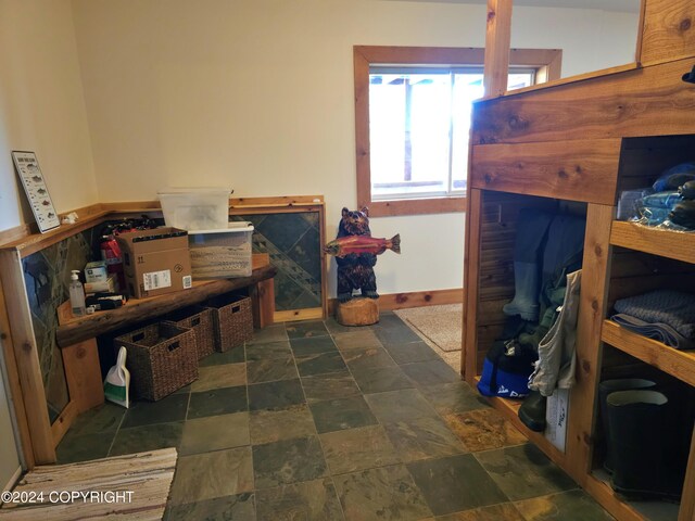 bedroom with stone finish flooring