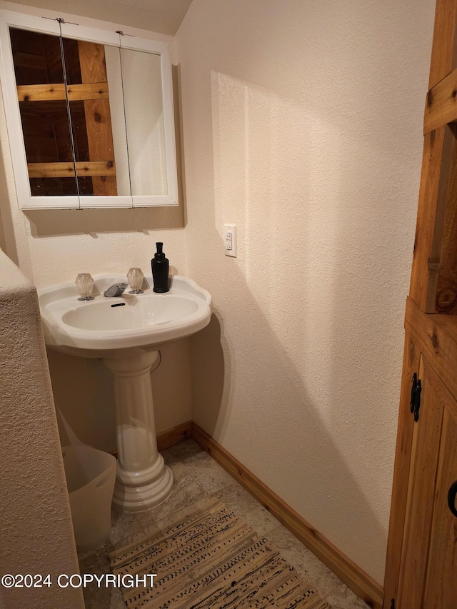 bathroom featuring baseboards