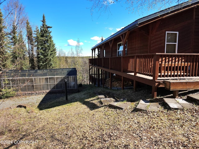 view of yard with a wooden deck