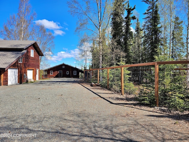 view of road with driveway