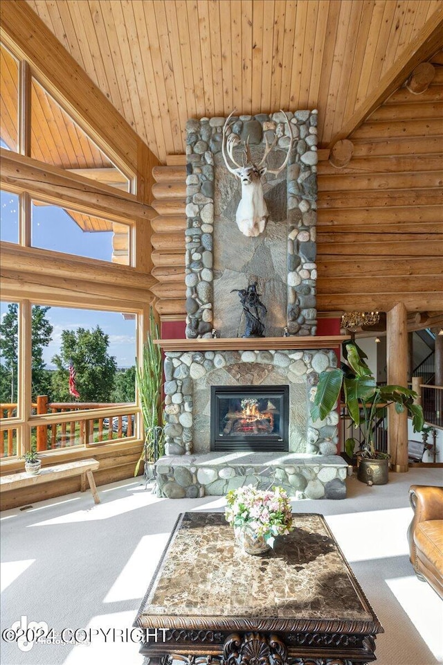 unfurnished living room with log walls, a fireplace, wooden ceiling, and carpet