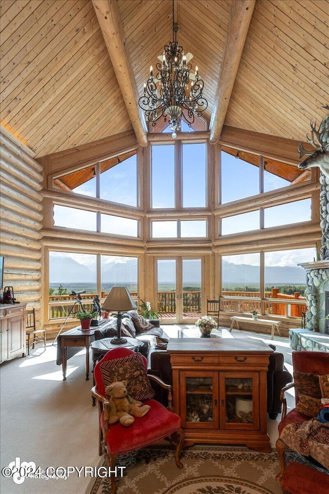 living room with high vaulted ceiling, a mountain view, carpet floors, and beamed ceiling