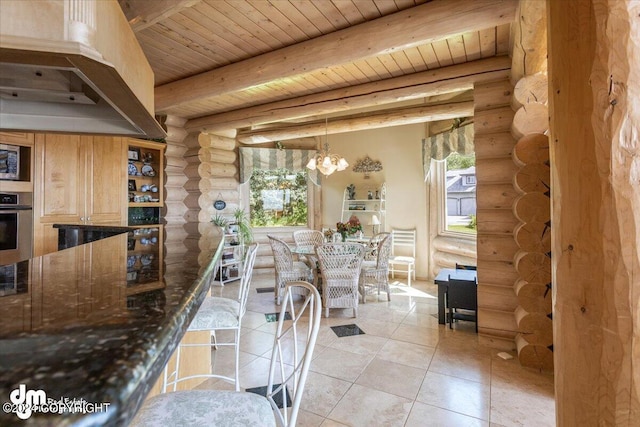 kitchen featuring light tile patterned flooring, wood ceiling, stainless steel oven, beam ceiling, and an inviting chandelier