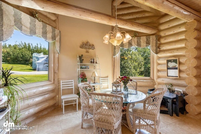 dining area featuring rustic walls, a notable chandelier, and beam ceiling