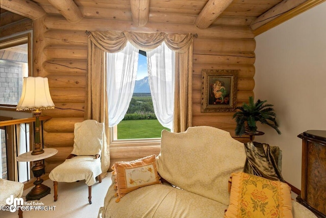 sitting room featuring wood ceiling, plenty of natural light, and beam ceiling