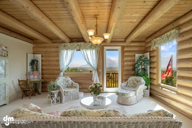 sunroom with a healthy amount of sunlight, an inviting chandelier, wooden ceiling, and beam ceiling