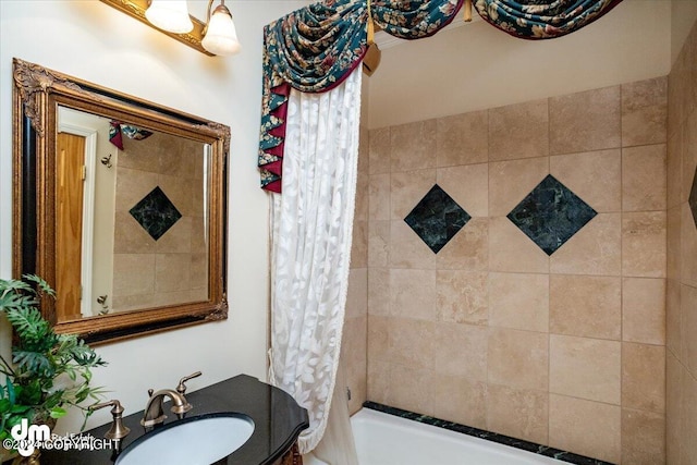 full bath featuring shower / tub combo and vanity