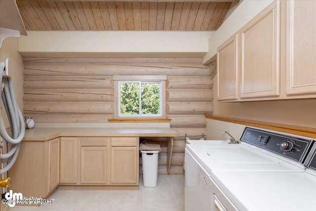 laundry area featuring wood ceiling, cabinet space, and independent washer and dryer