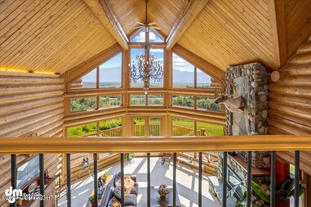 interior space with wooden ceiling, a mountain view, and high vaulted ceiling