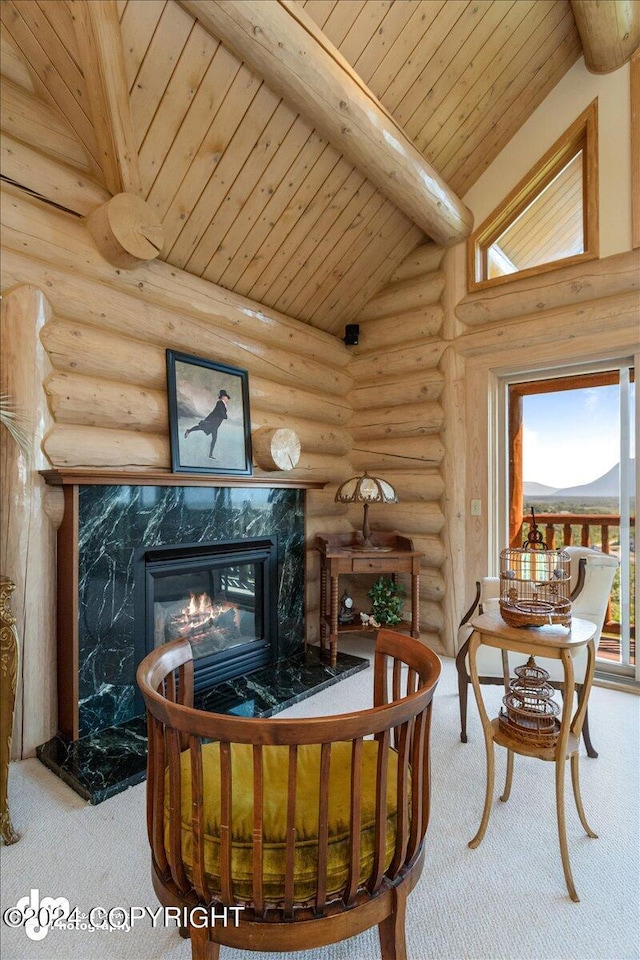 living area with carpet, a fireplace, log walls, and beam ceiling