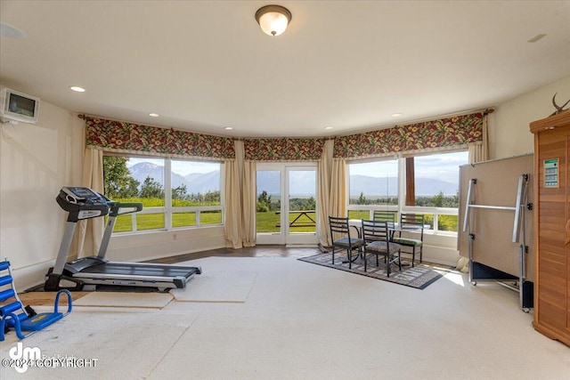 workout room featuring recessed lighting and a mountain view