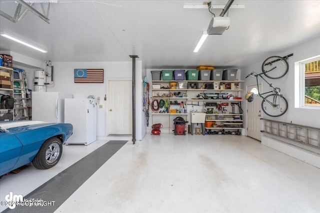 garage with a garage door opener and freestanding refrigerator