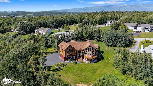 aerial view featuring a mountain view and a forest view