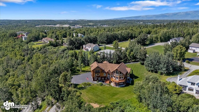 drone / aerial view with a view of trees