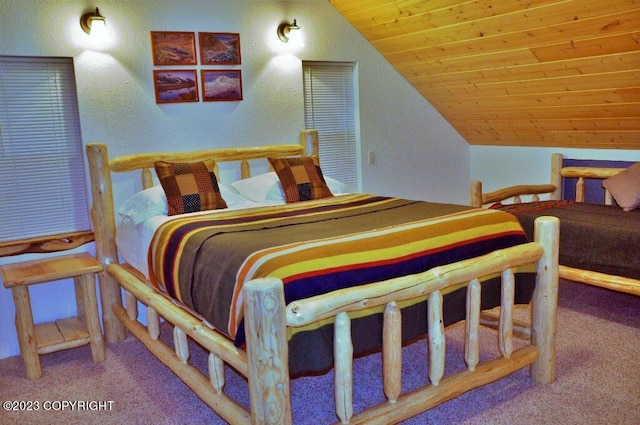 bedroom featuring carpet, wooden ceiling, and vaulted ceiling