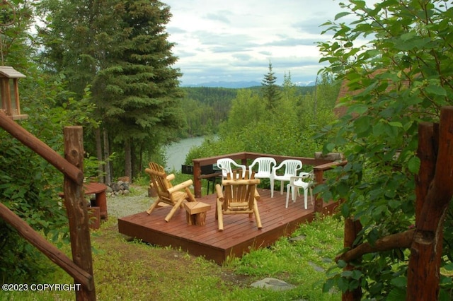 deck featuring a forest view