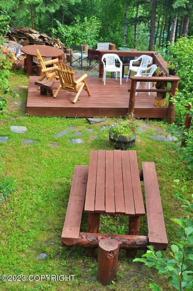 view of yard with an outdoor living space and a wooden deck