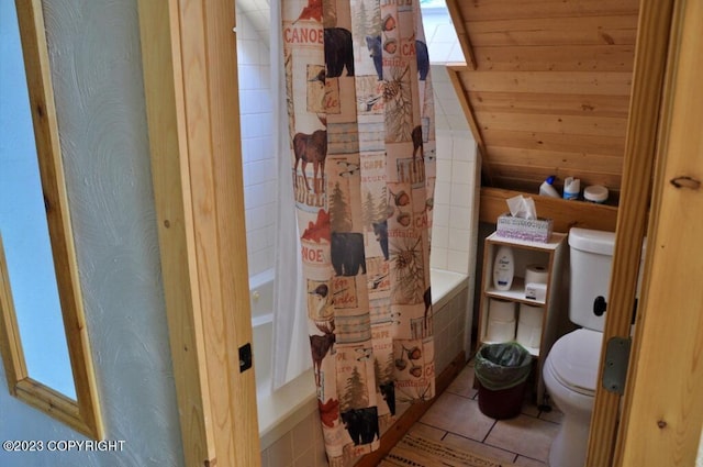 full bath with toilet, tile patterned flooring, and shower / bath combination with curtain