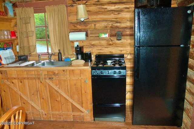 kitchen with black appliances and a sink