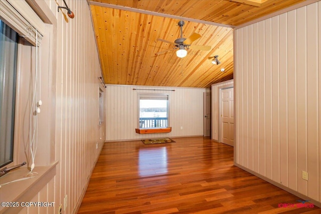 spare room featuring ceiling fan, wooden ceiling, lofted ceiling, and wood finished floors