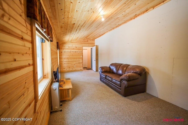 carpeted living room with wooden ceiling, radiator, wood walls, and vaulted ceiling