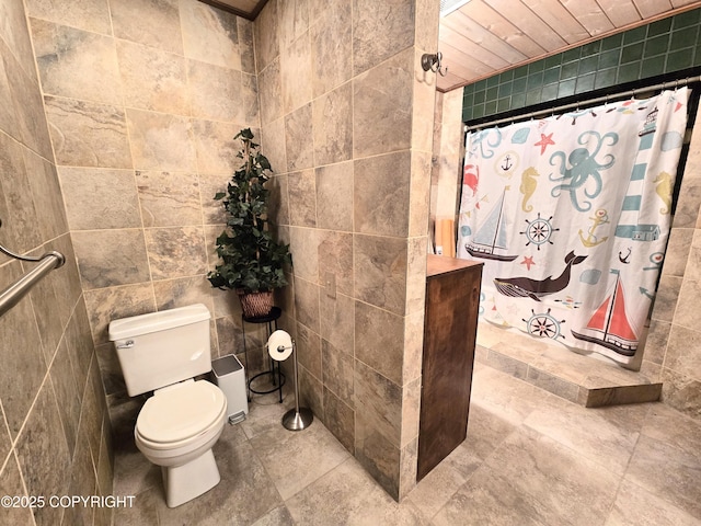 bathroom featuring tile patterned floors, toilet, and a shower with shower curtain