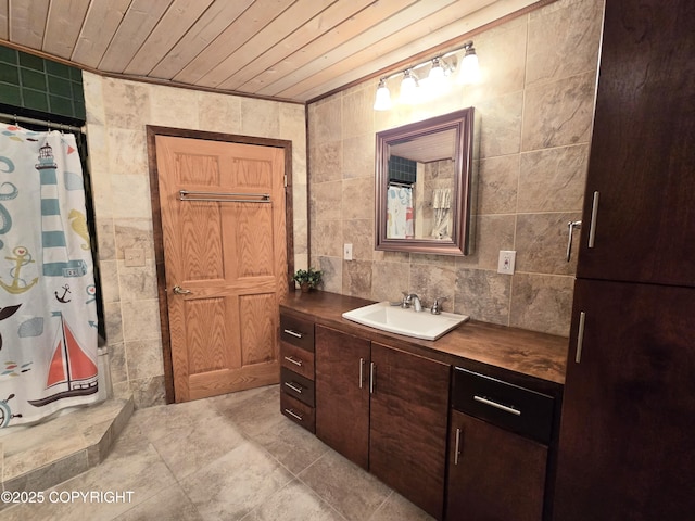 full bath featuring wood ceiling, a shower with curtain, tile walls, and vanity